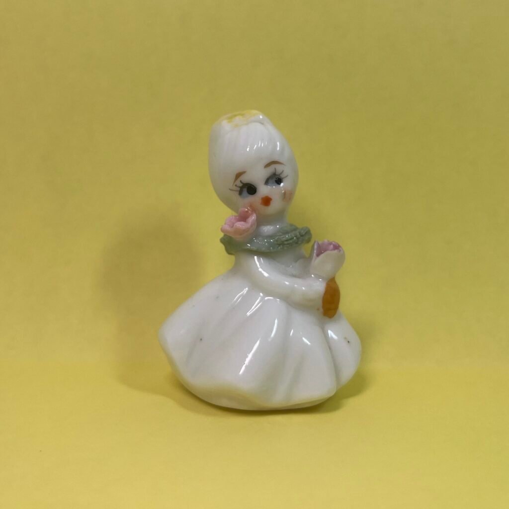 Napco Flower girl with yellow bow