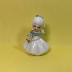 Napco-Style 2" Bone China girl with blue bow and yellow flowers